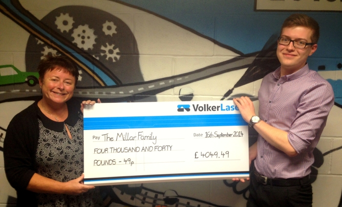 Amanda and James with cheque from the BBQ.JPG