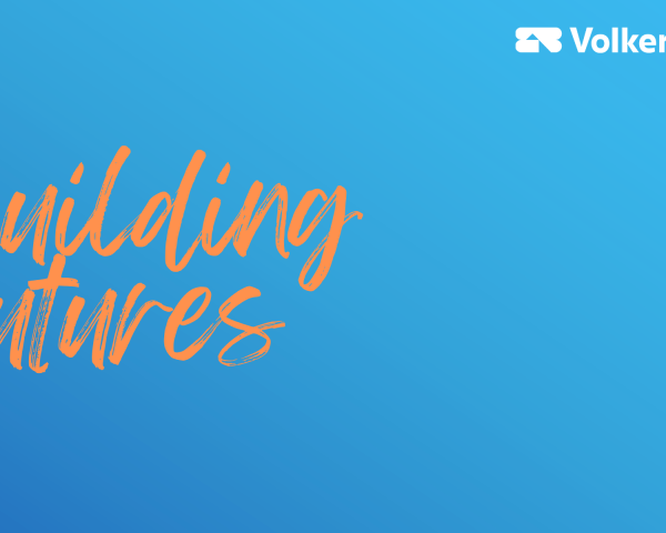 Blue gradient background with orange text to the left reading 'building futures' and VolkerLaser's logo in the top right corner